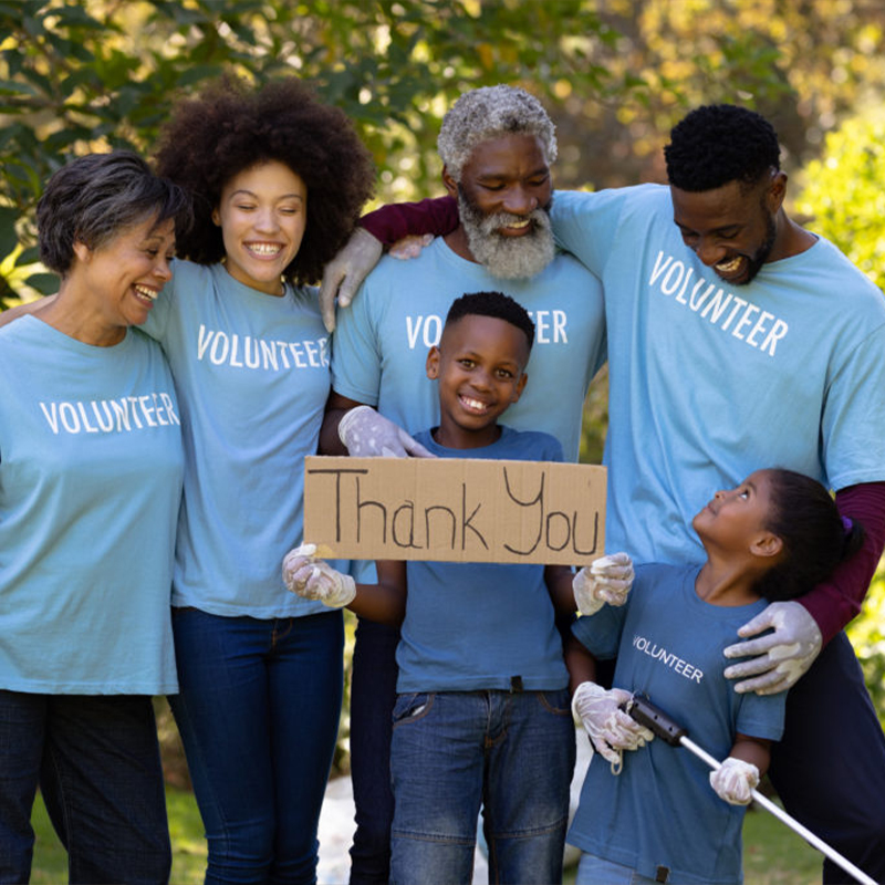 Group of volunteers with two kids